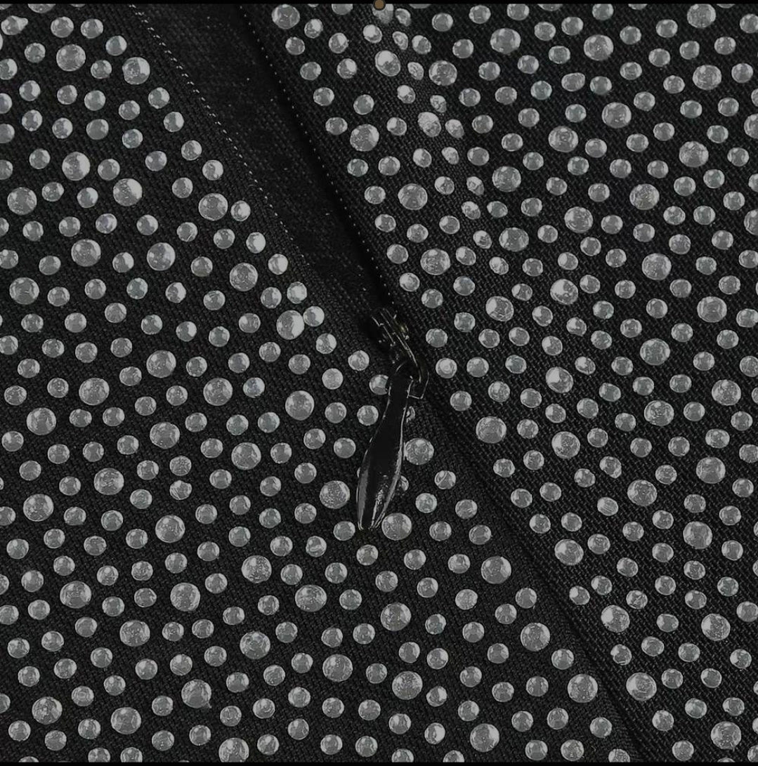 black double-breasted blazer and shimmering or crystal-embellished flare pants