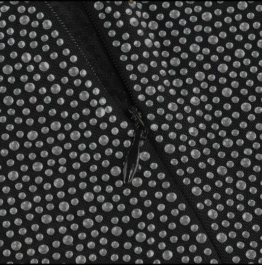 black double-breasted blazer and shimmering or crystal-embellished flare pants