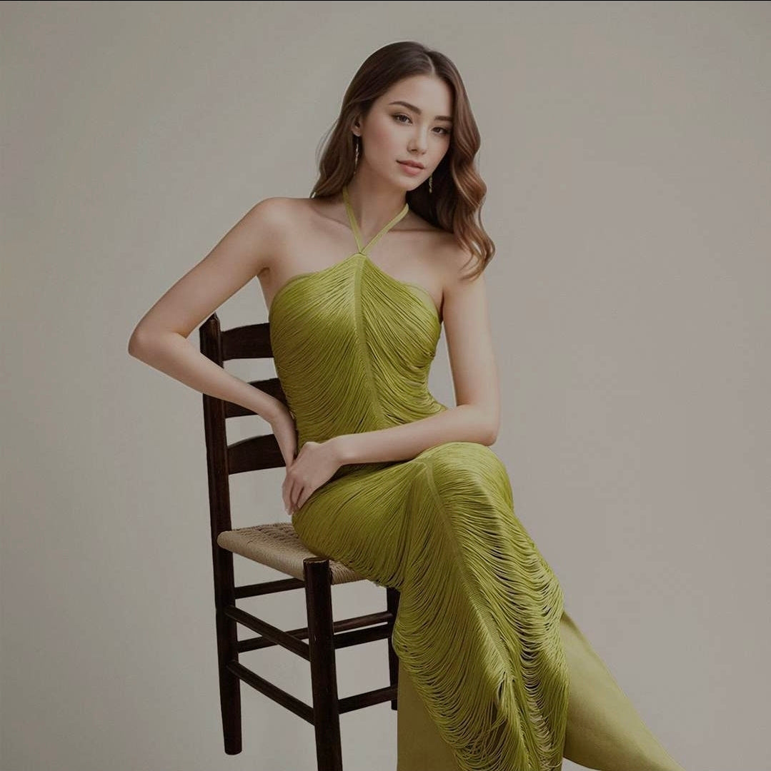 Long halter-neck dress with extensive green fringe and an open back
